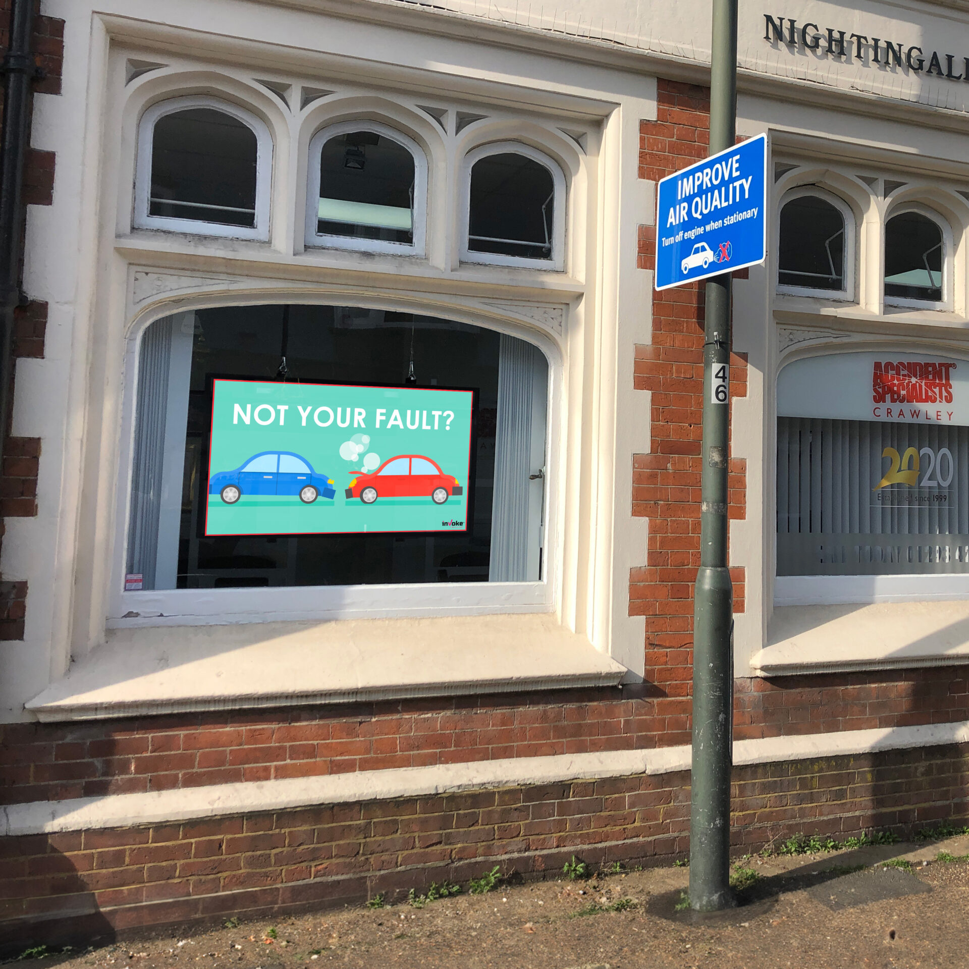 nightingale insurance shop window screen playing animated video about car insurance with them