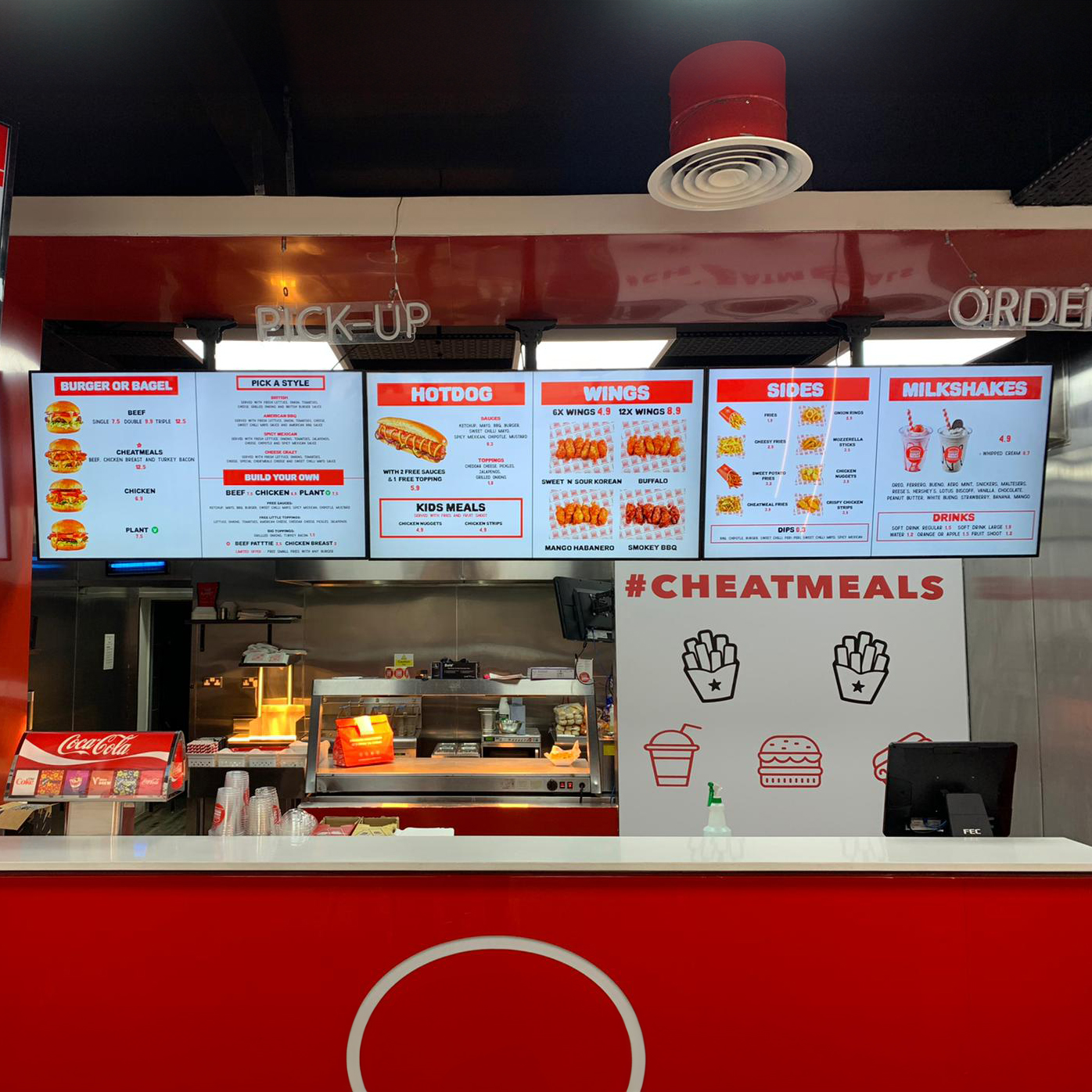 cheatmeals fast food restaurant digital menu boards above the counter